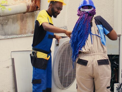 professionals working on air conditioner